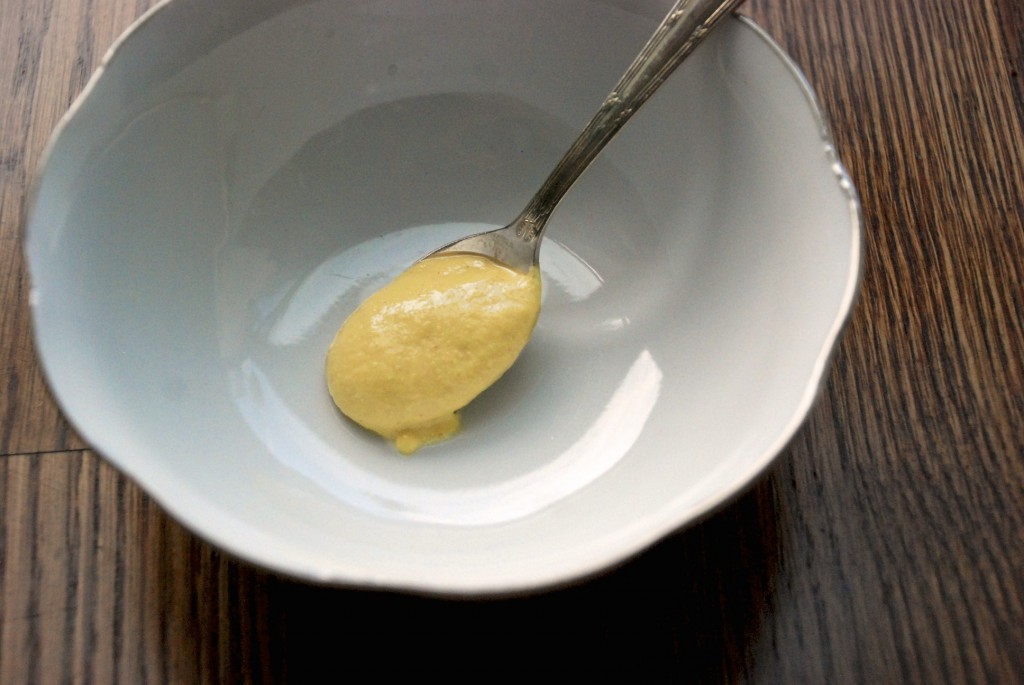 Spoon mustard into a mixing bowl