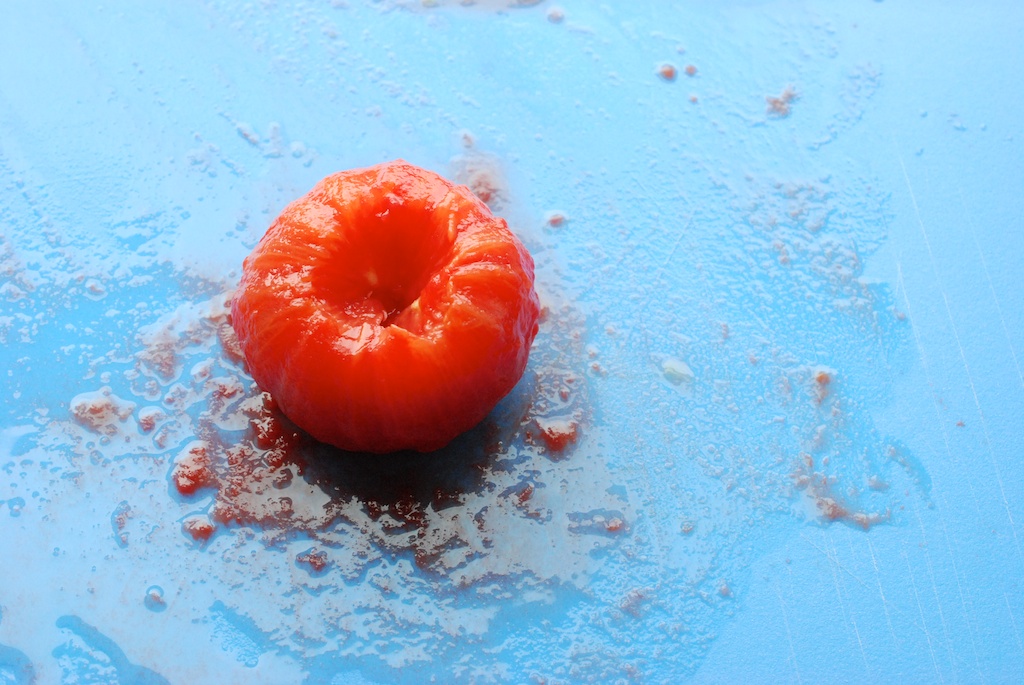 skinless tomato, on cutting board