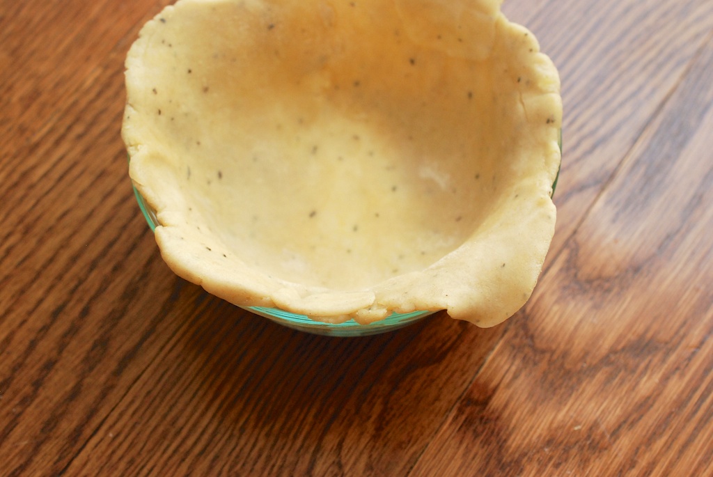 rosemary-cheddar pie crust in pie dish