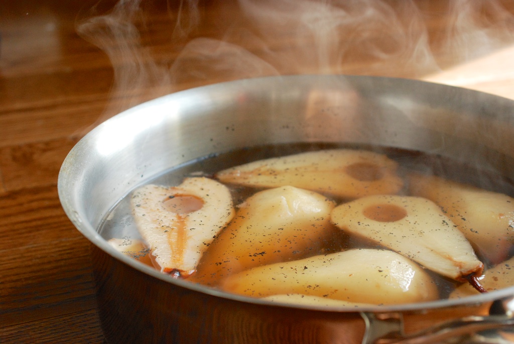poached pears, in their cooking liquid